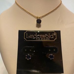 Gold colored 17 1/2” chain & pierced stud earrings with a topaz stones.